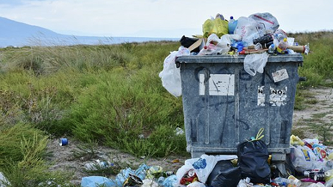 overflowing rubbish bin in a remote mountain setting  - Leave no trace: The 7 Principles - Dispose of Waste