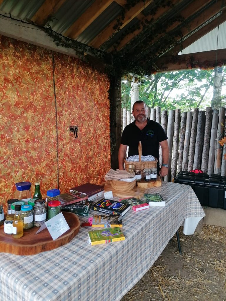 Brian behind foraging samples table