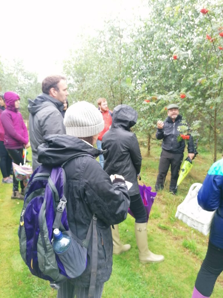 Brian showing foraging group rowan berries