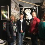 Pupil at exhibition with family