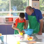 Father and son baking at the Cupcake Event